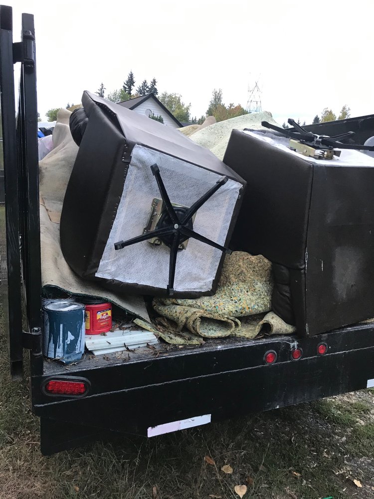 Furniture and carpet loaded for junk hauling