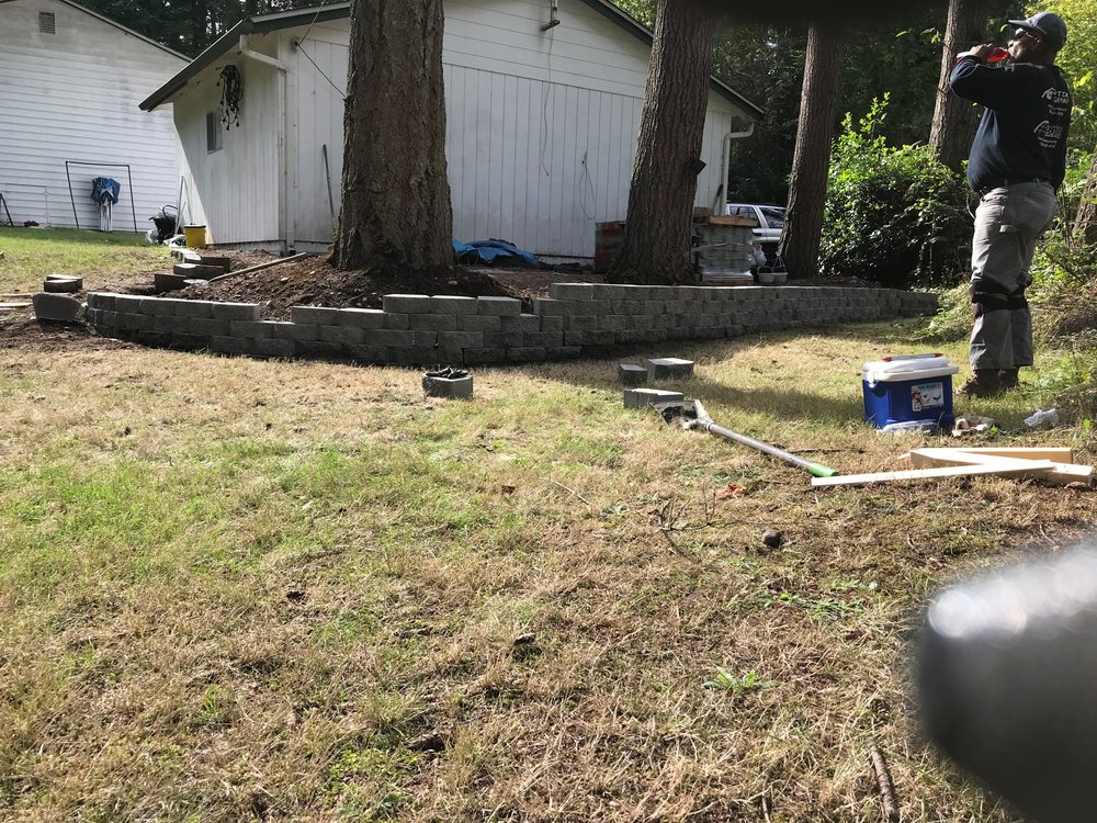 Patio and retaining wall construction in progress