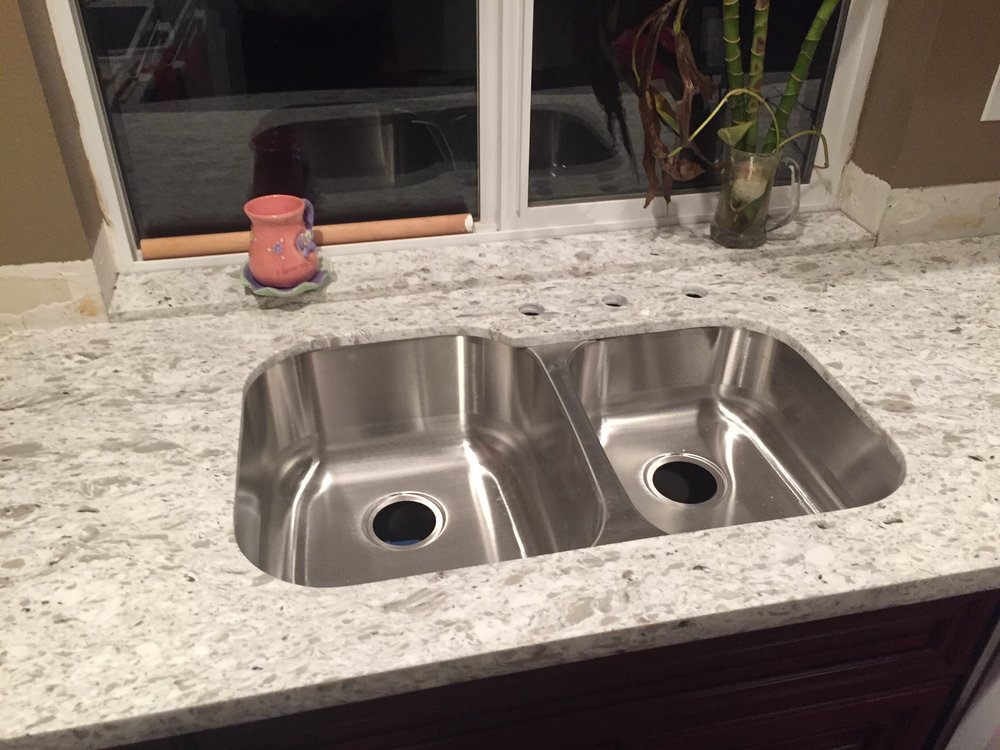 Kitchen sink installation with granite countertop
